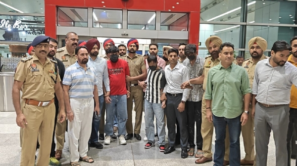 Punjab Police detaining accused at Delhi Airport